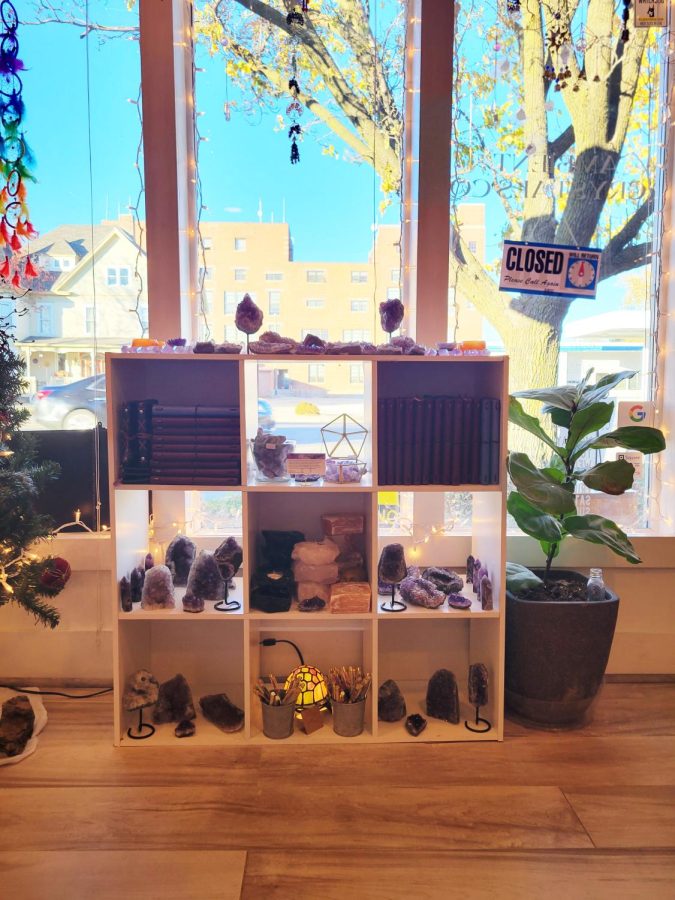 This+is+one+of+many+shelves+in+the+shop.+This+one+prominently+displays+amethyst%2C+journals%2C+and+crystal+tea+light+candle+holders%2C+among+other+objects.+Photo+by+Rowan+Van+Osdel