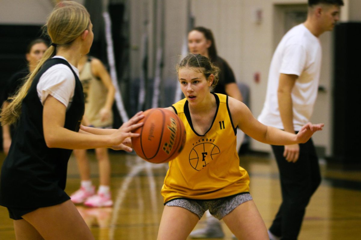 Junior Jenna McClain guards senior Sydney Glause during practice. “What is going to motivate me this year is being able to play with my friends,” McClain said. “Even though we played well last year, there are many things to improve on, and that is what is motivating me.”