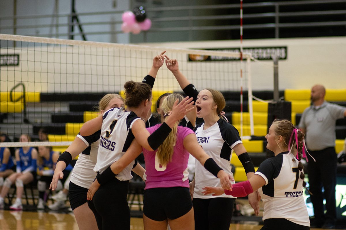 After scoring a point, the Lady Tigers huddle. 