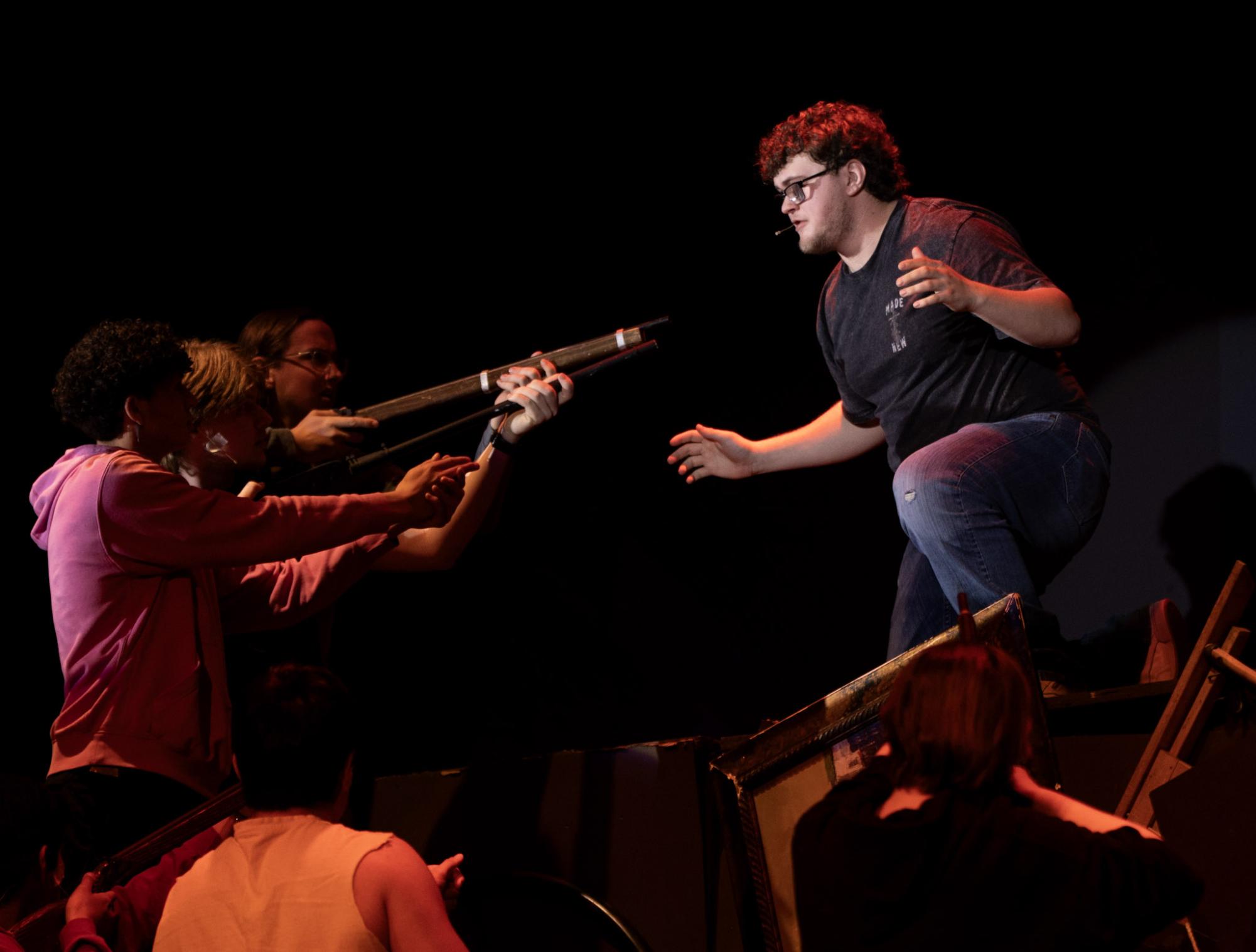 Senior Cody Stueve rehearses a scene as Jean Valjean during "Les Misérables" at Fremont High School. Photo by