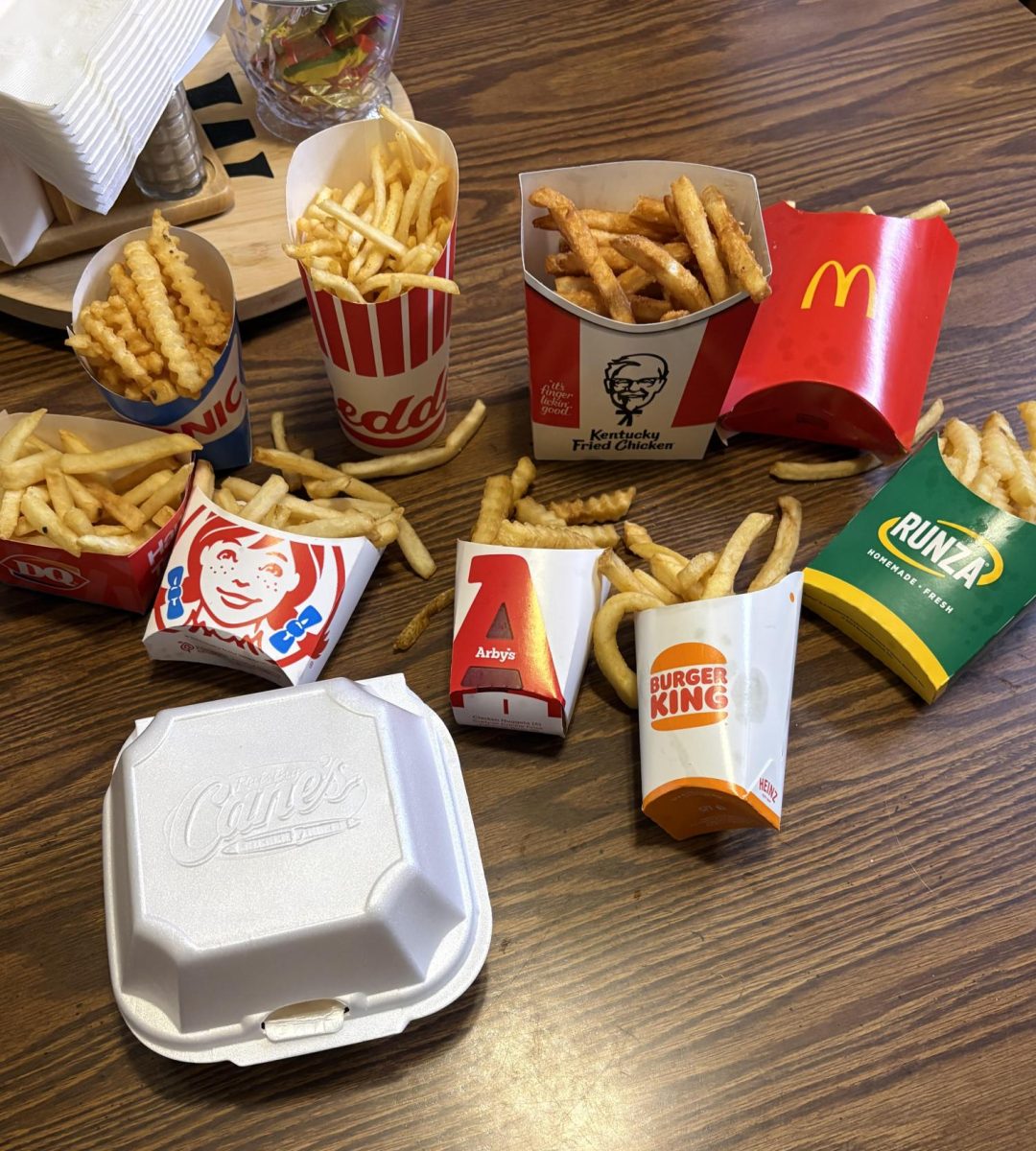French fries from 10 fast-food restaurants in Fremont, Nebraska, are arranged on a dining table during a taste test to determine which fries rank best.