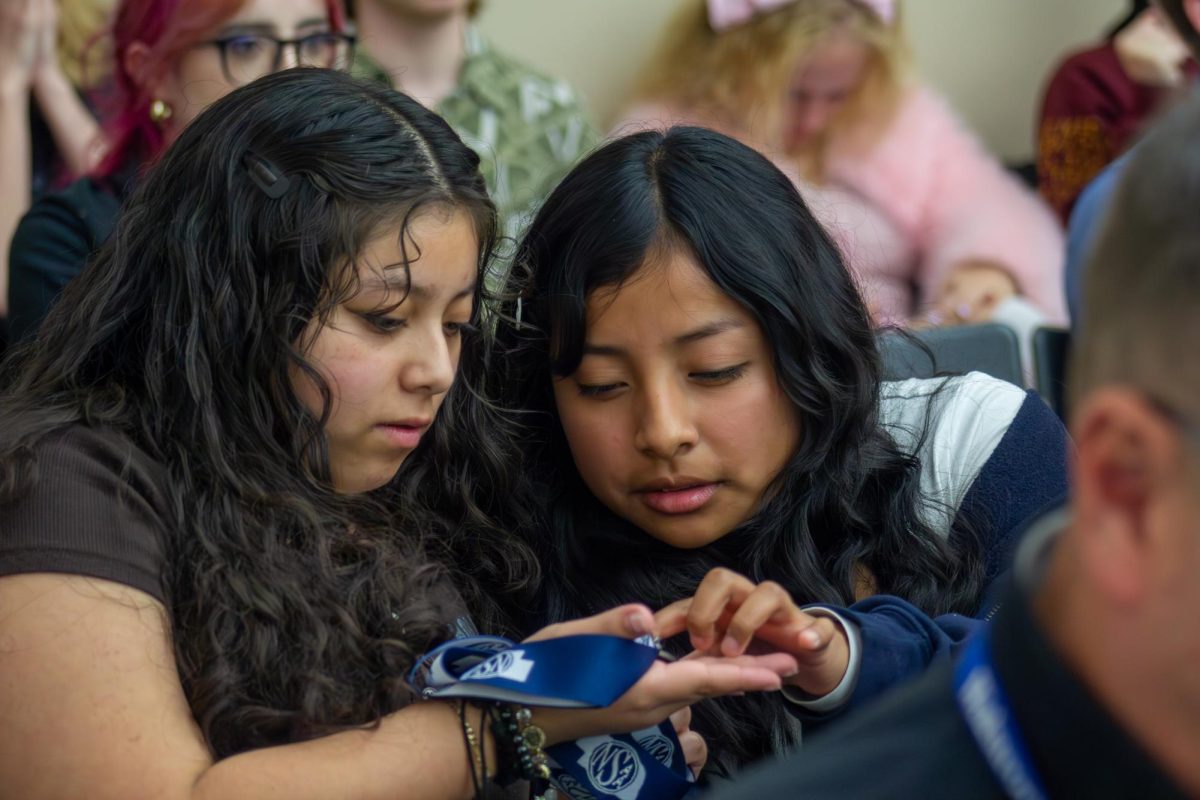 Sophomore Jerenima Nas Guarcas examines her medal with Hannaly Sandoval Garcia. In addition to winning her 8th place award for editorial cartooning, Nas Guarcas shares her favorite moment. “My favorite moment would have to probably be going to target and just walking around with Hanny and looking at albums,” Nas Guarcas said.